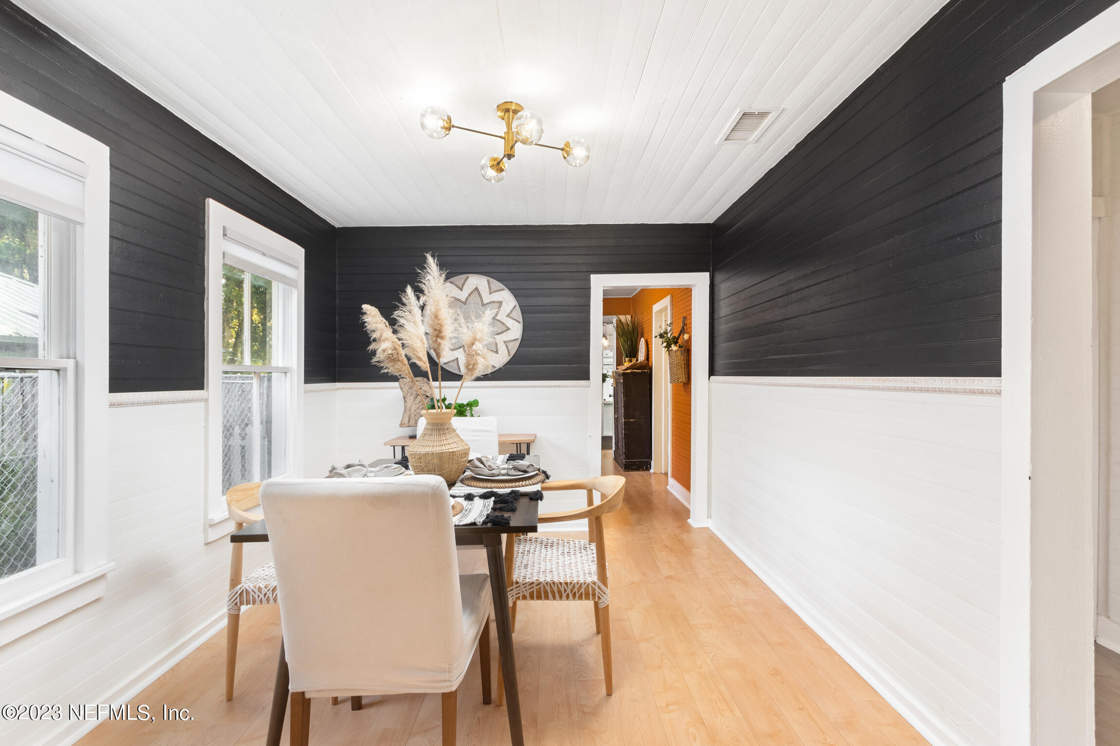 11 Newcomb Street St. Augustine, FL 32084 - Photo 9 of 35 a view of a dining room with furniture and wooden floor