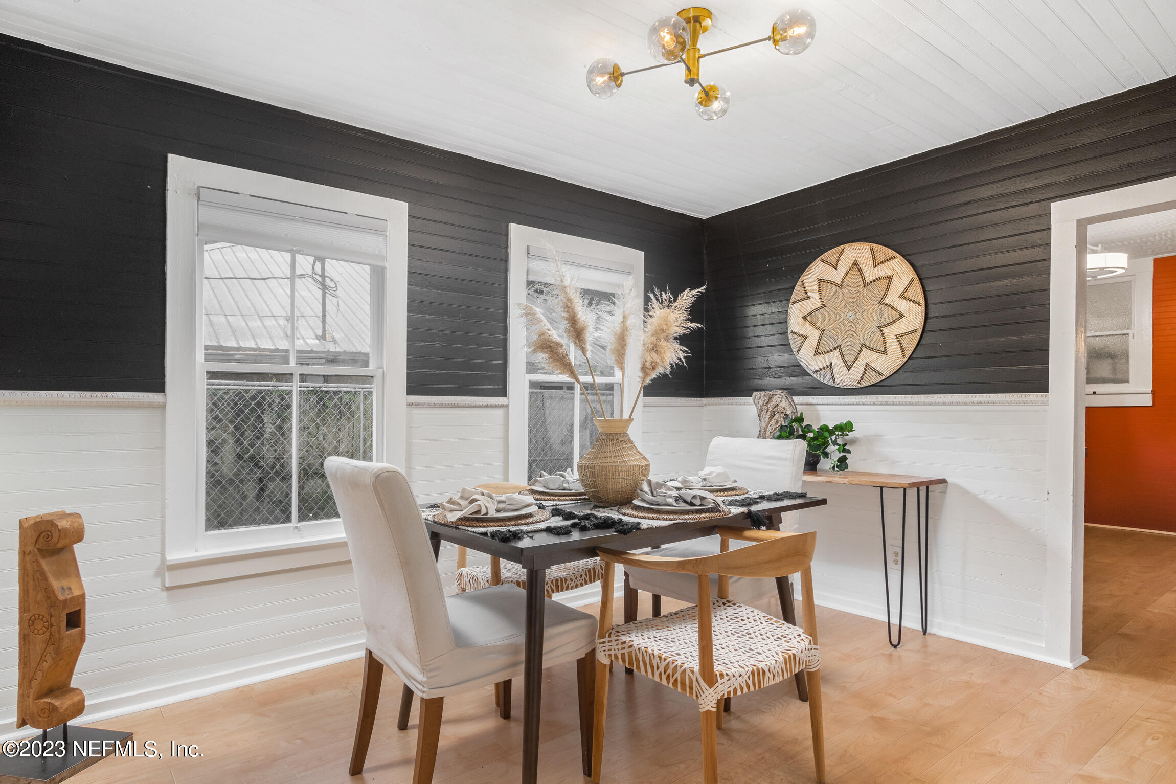11 Newcomb Street St. Augustine, FL 32084 - Photo 10 of 35 a dining room with furniture and a large window