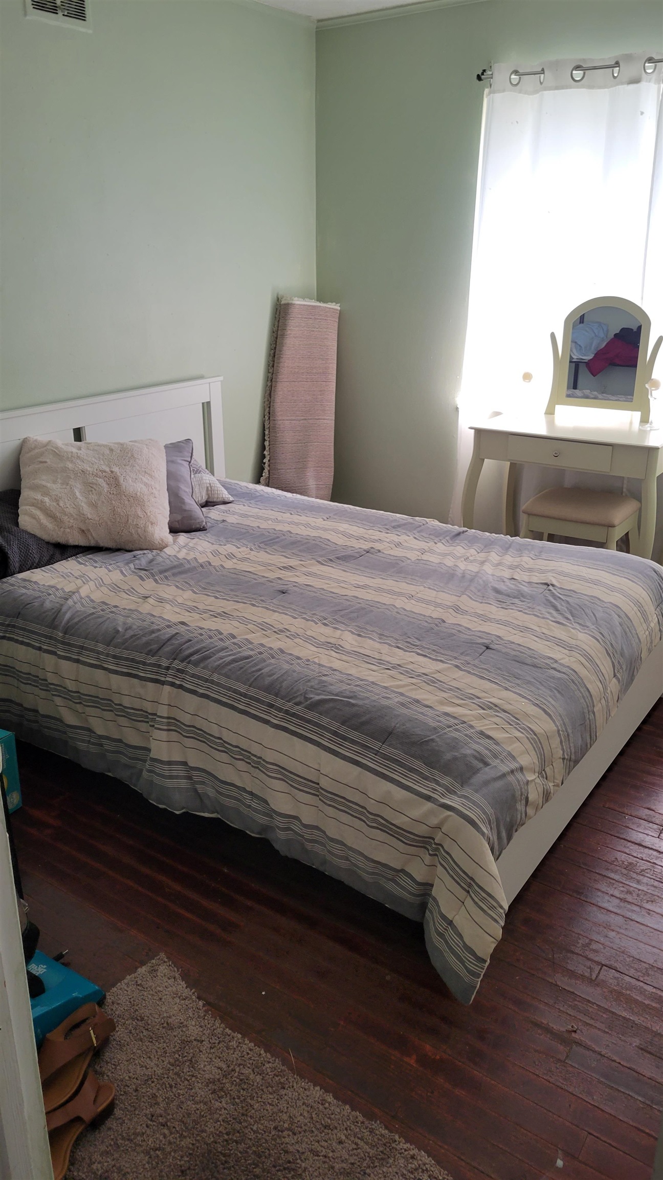 1532 Duke Road Memphis, TN 38108 - Photo 4 of 13 a bedroom with a bed and a large mirror