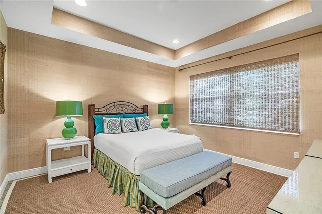 a living room with a bed furniture and a window