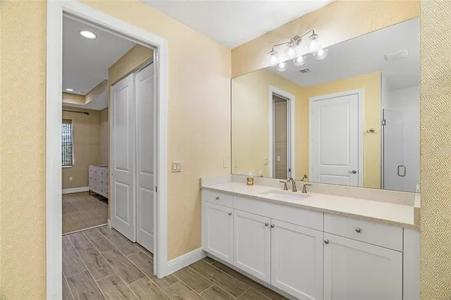 a spacious bathroom with a double vanity sink mirror and toilet