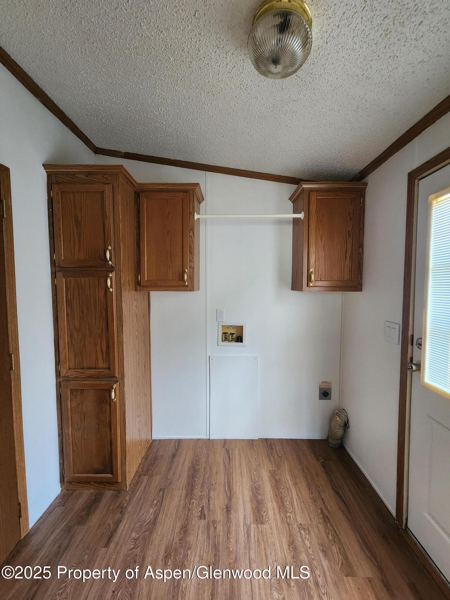 262 East Tamarack Circle Parachute, CO 81635 - Photo 11 of 18 a view of a livingroom with wooden floor and window