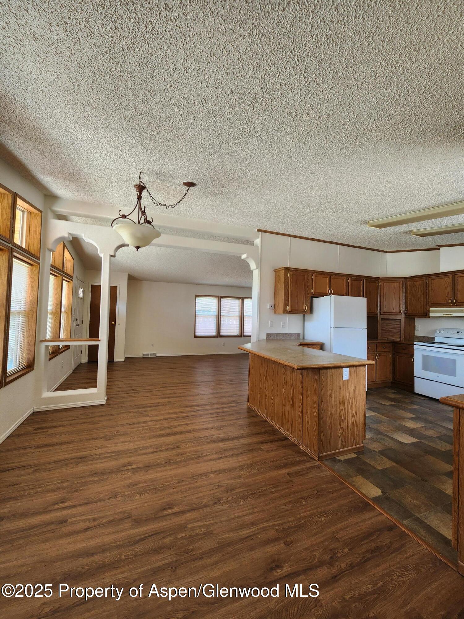 262 East Tamarack Circle Parachute, CO 81635 - Photo 12 of 18 a view of a living room and kitchen view