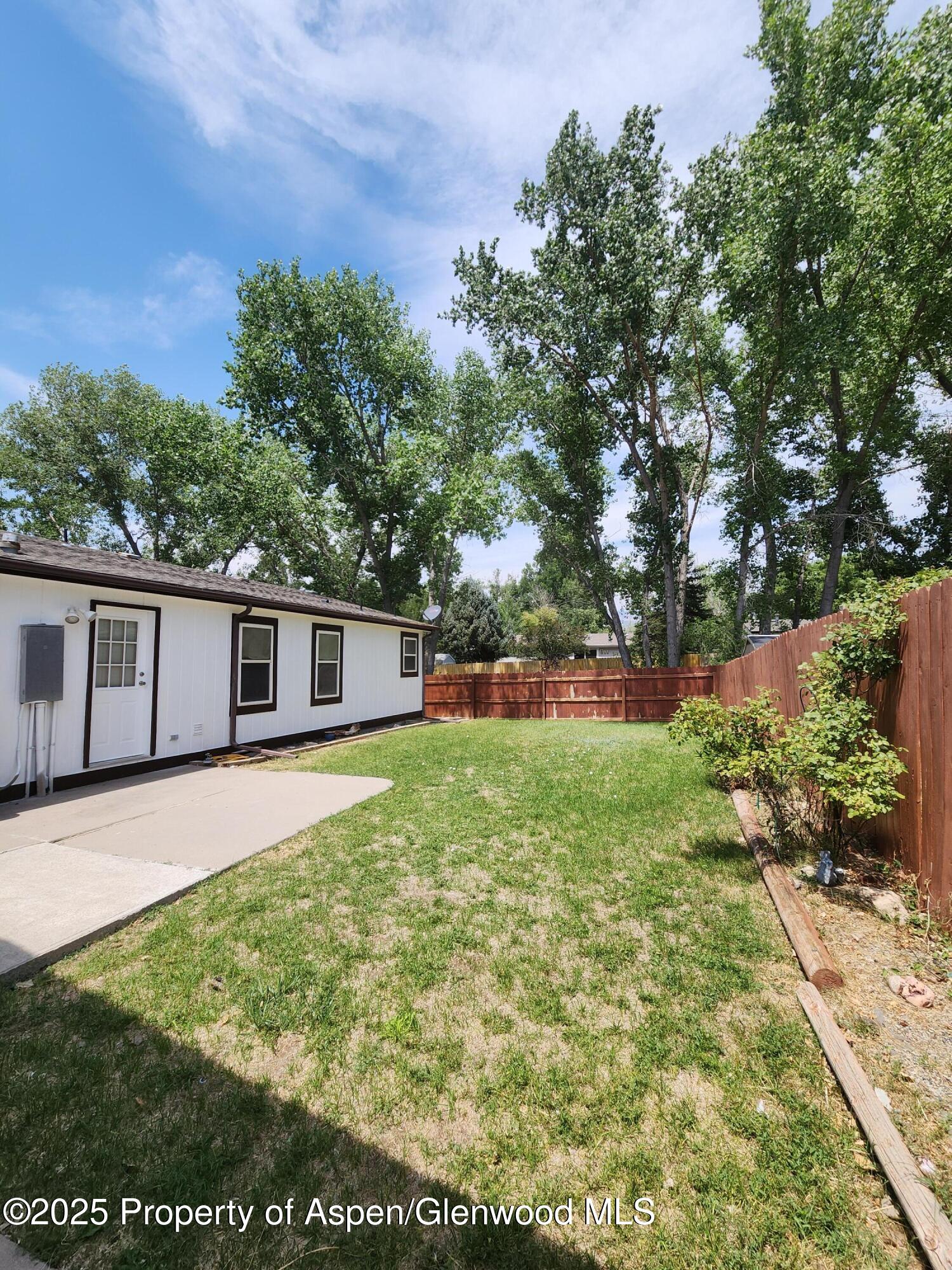 262 East Tamarack Circle Parachute, CO 81635 - Photo 16 of 18 a house view with a garden space
