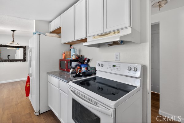 13391 Mesquite Road Whitewater, CA 92282 - Photo 11 of 27 a kitchen with a stove and cabinets