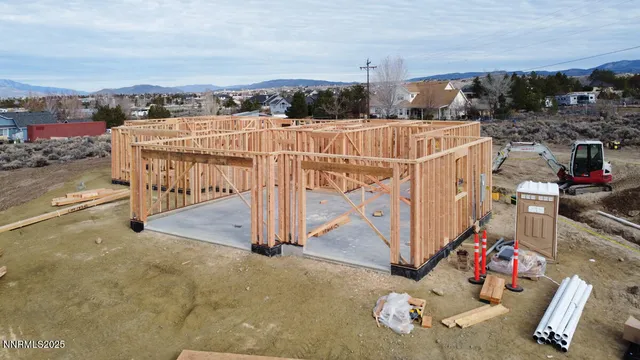 a view of a terrace with lawn chairs