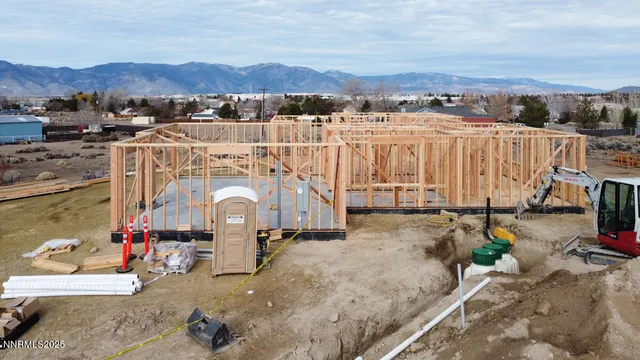 an aerial view of a house with a yard and a large window