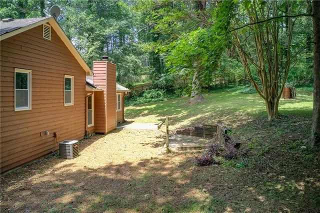 a backyard of a house with seating space