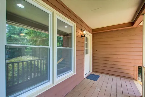 a view of a door and wooden floor