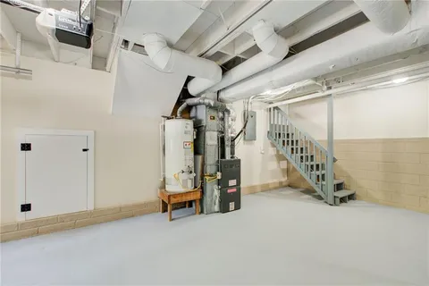 a backyard of a house with lots of green space and trees in the background