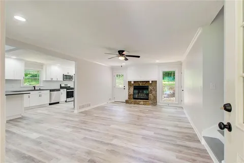 a view of an empty room with a window