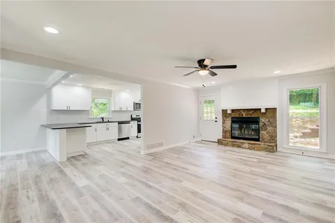 a view of a backyard with large trees