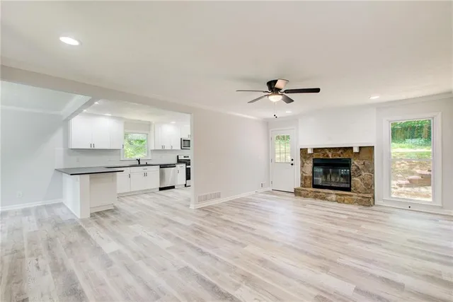 a view of a backyard with large trees
