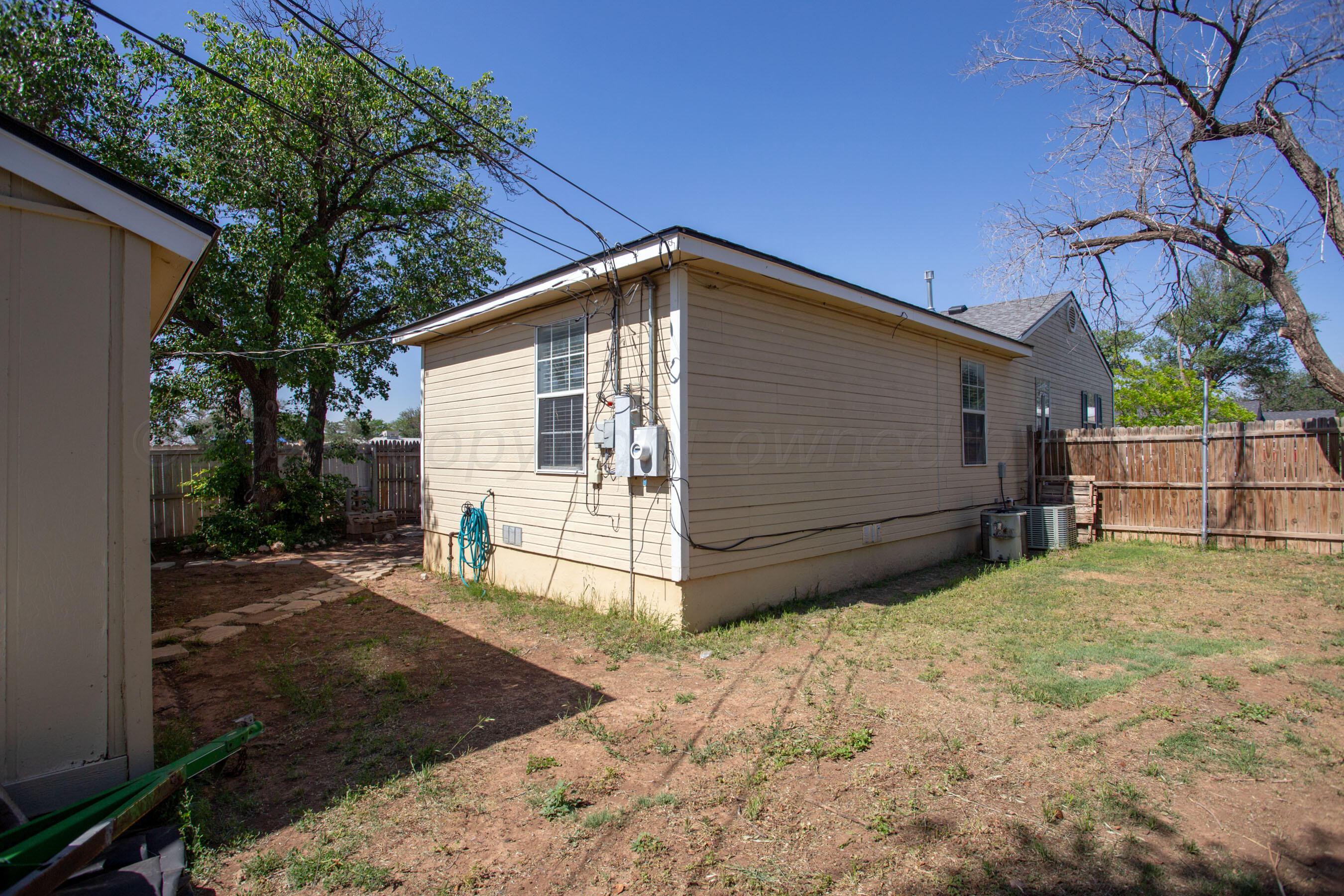 4625 South Travis Street Amarillo, TX 79110 - Photo 23 of 24 a view of a house with a yard