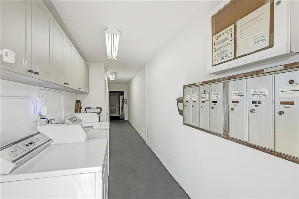2131 Northeast 40th Court Lighthouse Point, FL 33064 - Photo 24 of 32 a kitchen with white cabinets a sink a stove and a refrigerator