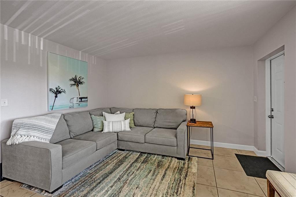 2131 Northeast 40th Court Lighthouse Point, FL 33064 - Photo 7 of 32 a living room with furniture and a couch