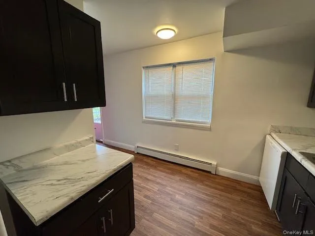 a kitchen that has a sink and a stove