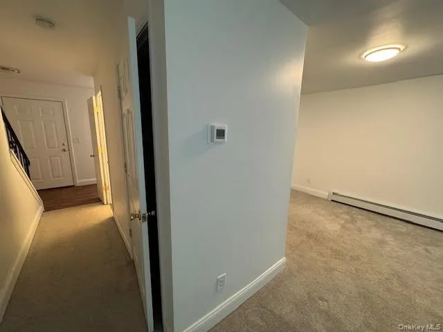 a view of a room with a hallway