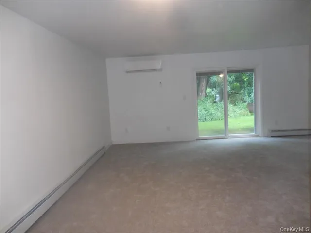 a view of a room that has a window in it