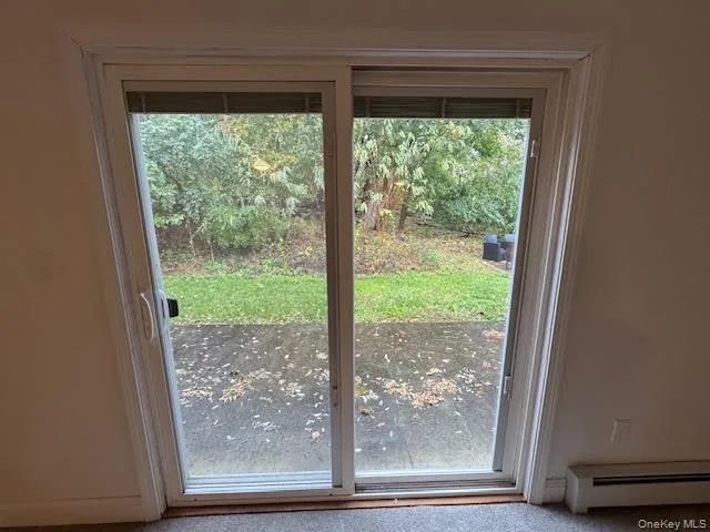 a view of a room that has a large window