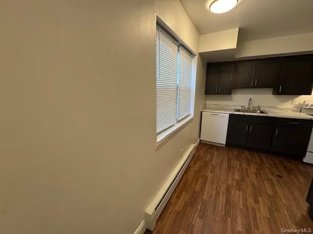 a view of hallway with wooden floor