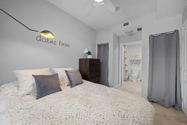 a bedroom with a bed and a closet