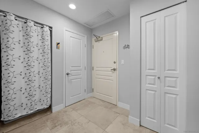 a view of a hallway with closet area