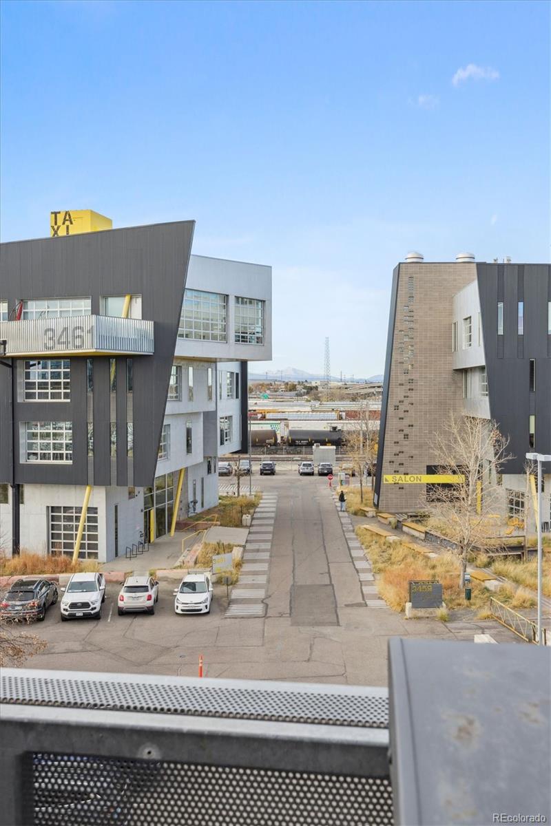 3457 Ringsby Court, Unit 304 Denver, CO 80216 - Photo 1 of 28 a view of a swimming pool with a lounge chairs