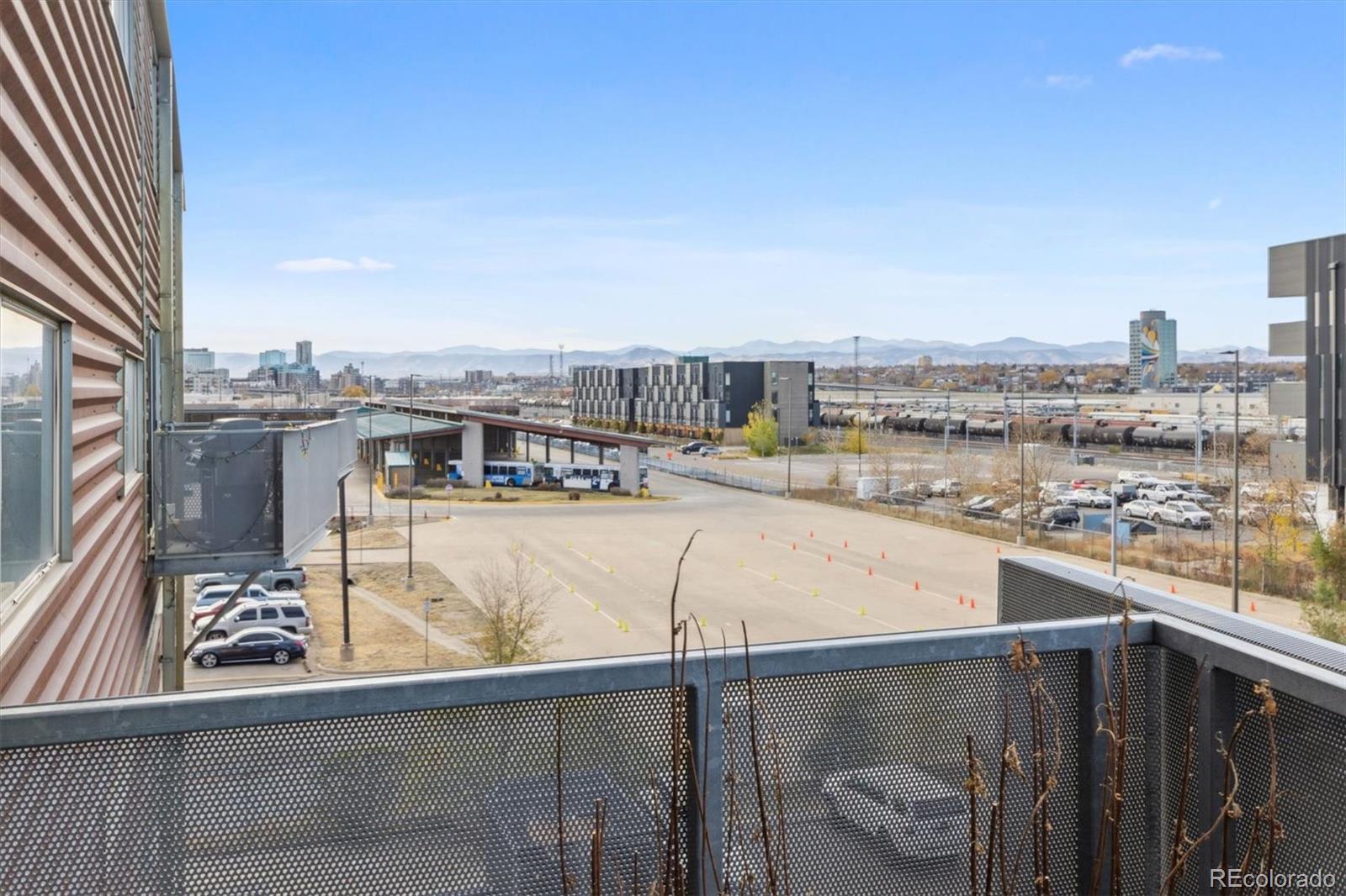 3457 Ringsby Court, Unit 304 Denver, CO 80216 - Photo 21 of 28 a view of a balcony with city view