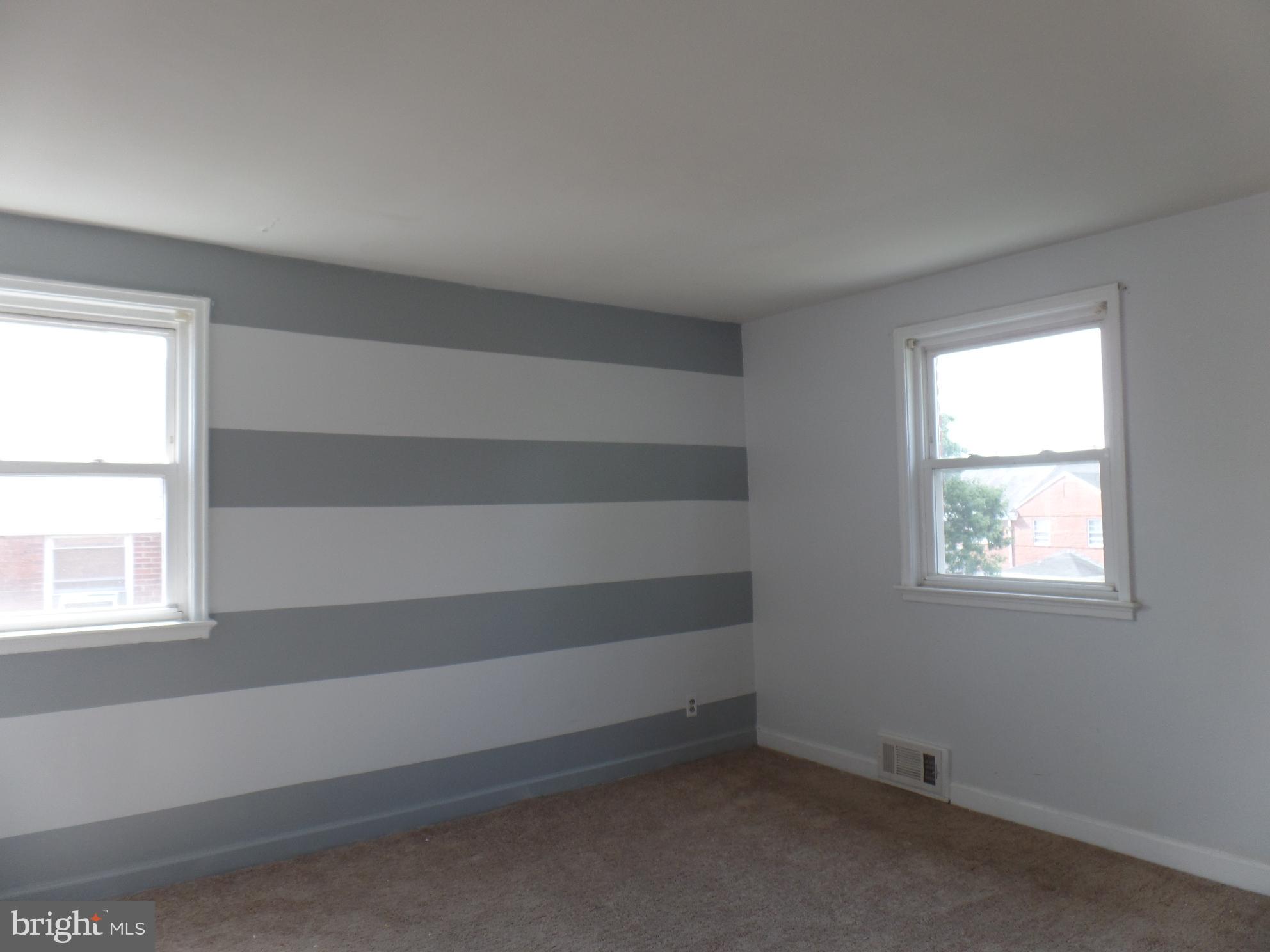 1816 Northbourne Road Baltimore, MD 21239 - Photo 5 of 14 an empty room with a window