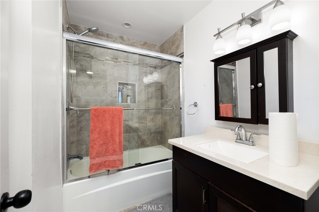 10757 Hortense, Unit 307 North Hollywood, CA 91602 - Photo 11 of 21 a bathroom with a sink and a mirror