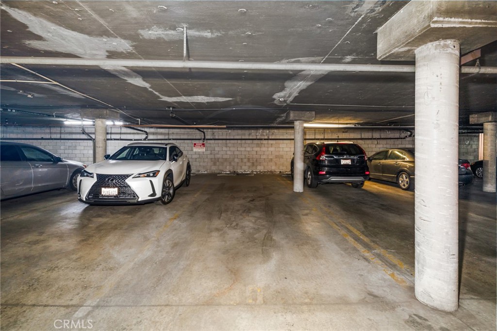 10757 Hortense, Unit 307 North Hollywood, CA 91602 - Photo 16 of 21 a car parked in garage