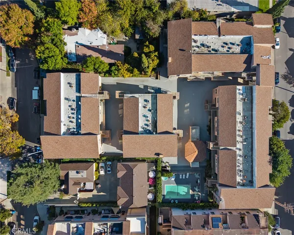 an aerial view of houses with outdoor space