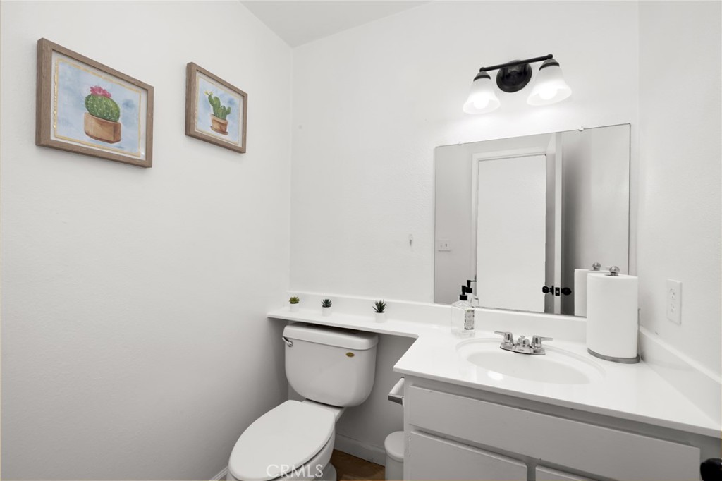 10757 Hortense, Unit 307 North Hollywood, CA 91602 - Photo 6 of 21 a bathroom with a toilet sink and mirror