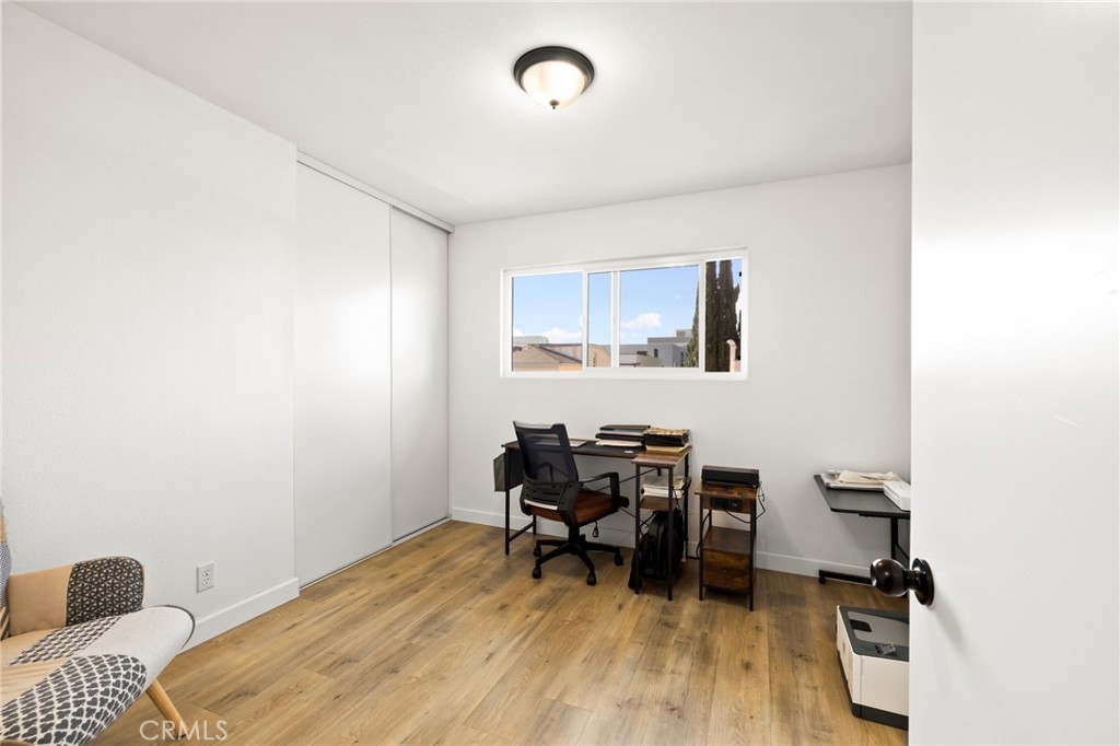 10757 Hortense, Unit 307 North Hollywood, CA 91602 - Photo 10 of 21 a workspace with furniture and wooden floor