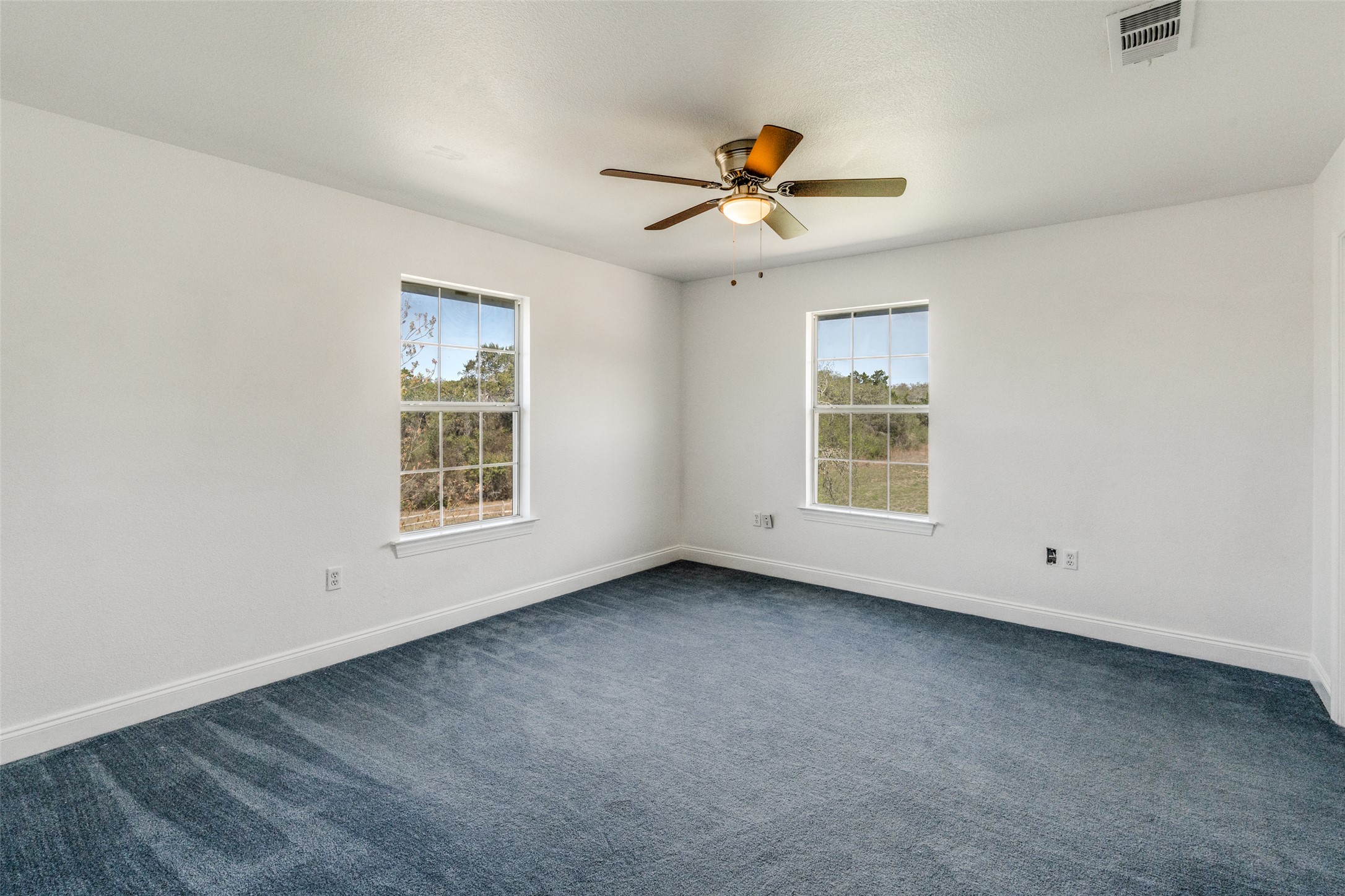 34970 Smithson Valley Road Bulverde, TX 78163 - Photo 18 of 36 a view of an empty room with a window