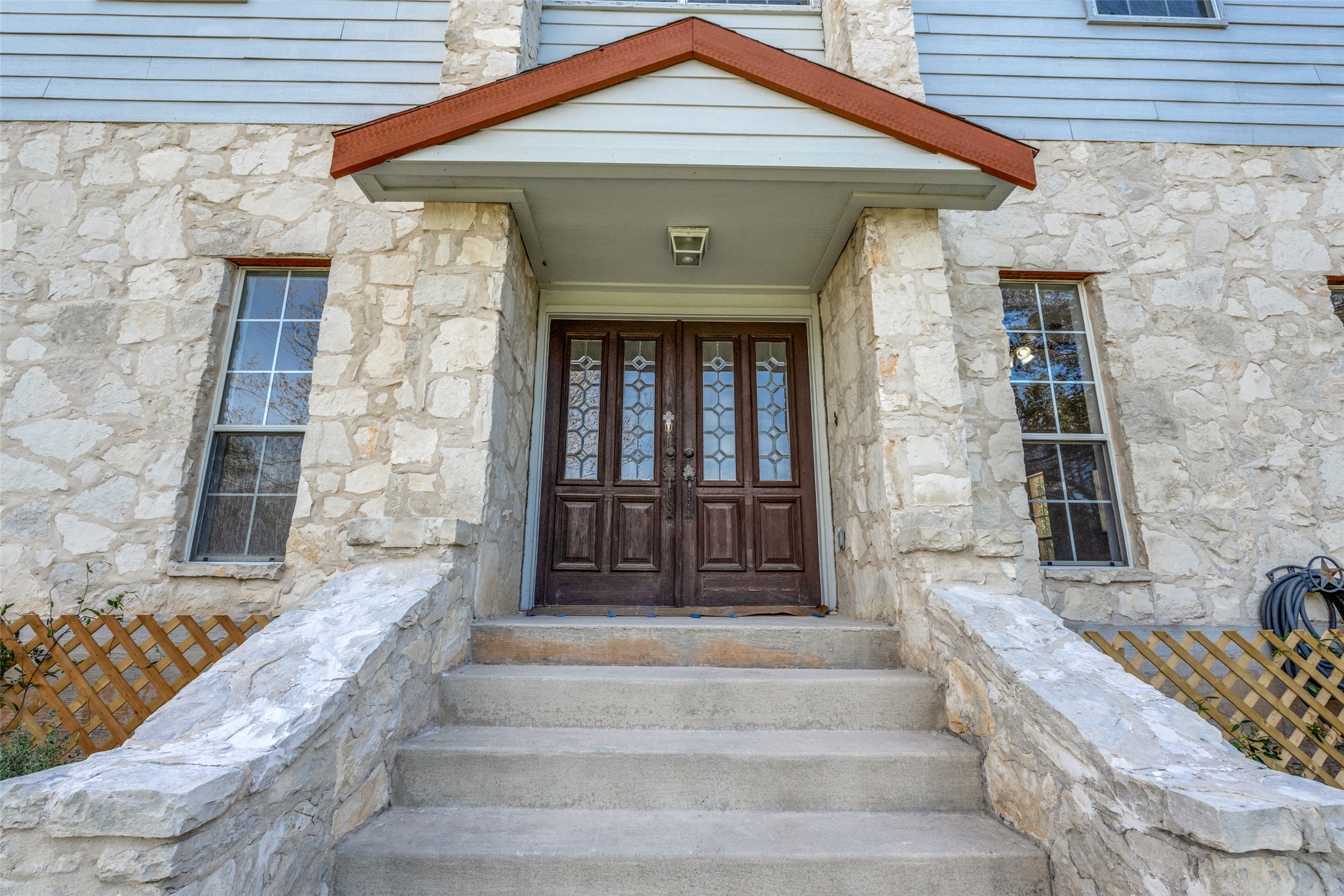 34970 Smithson Valley Road Bulverde, TX 78163 - Photo 2 of 36 a front view of a house with large windows