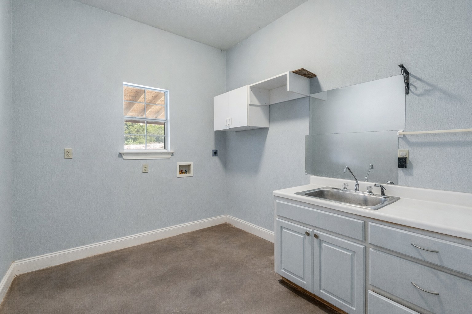 34970 Smithson Valley Road Bulverde, TX 78163 - Photo 19 of 36 a bathroom with a sink and a mirror