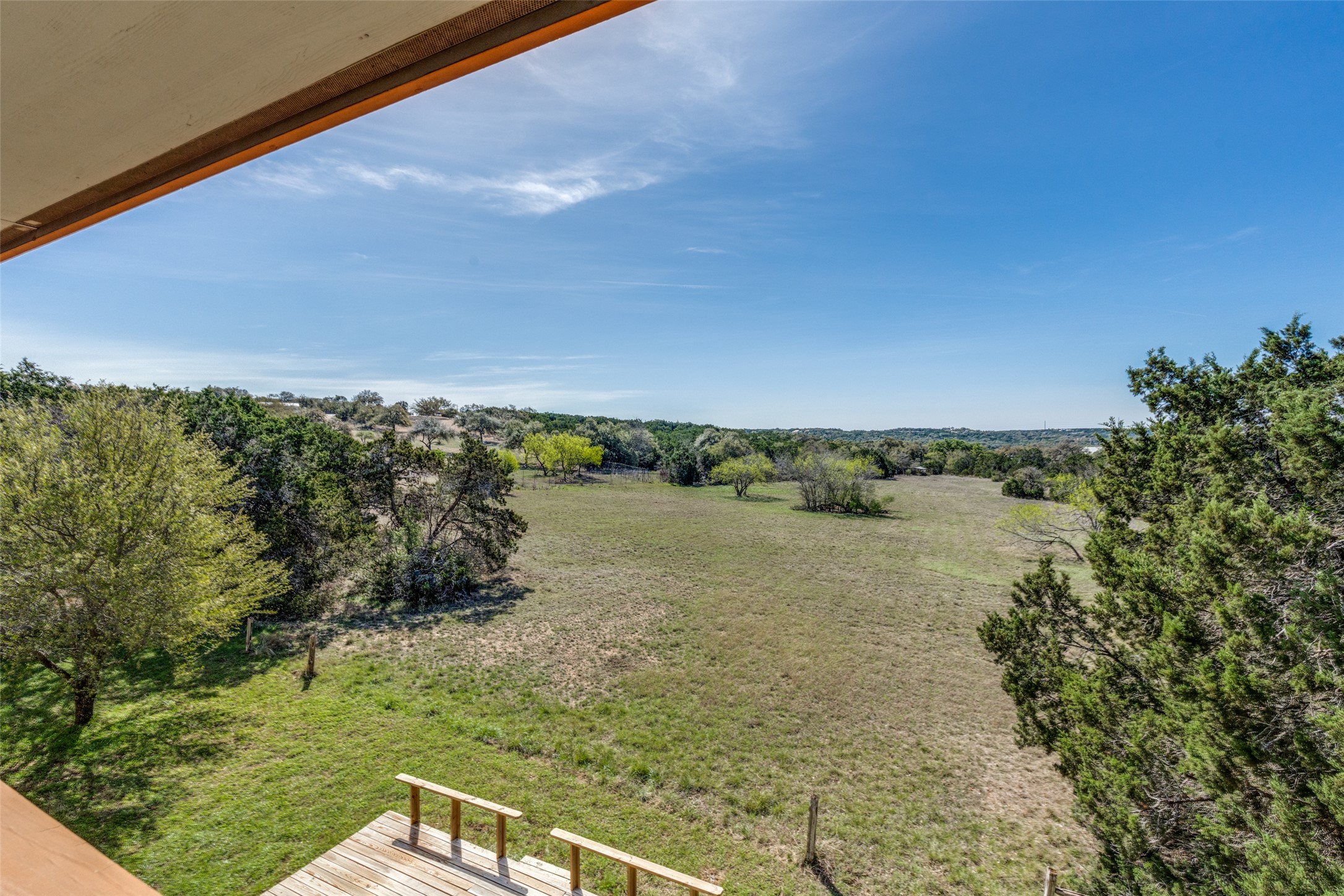 34970 Smithson Valley Road Bulverde, TX 78163 - Photo 22 of 36 a view of a lake with a yard