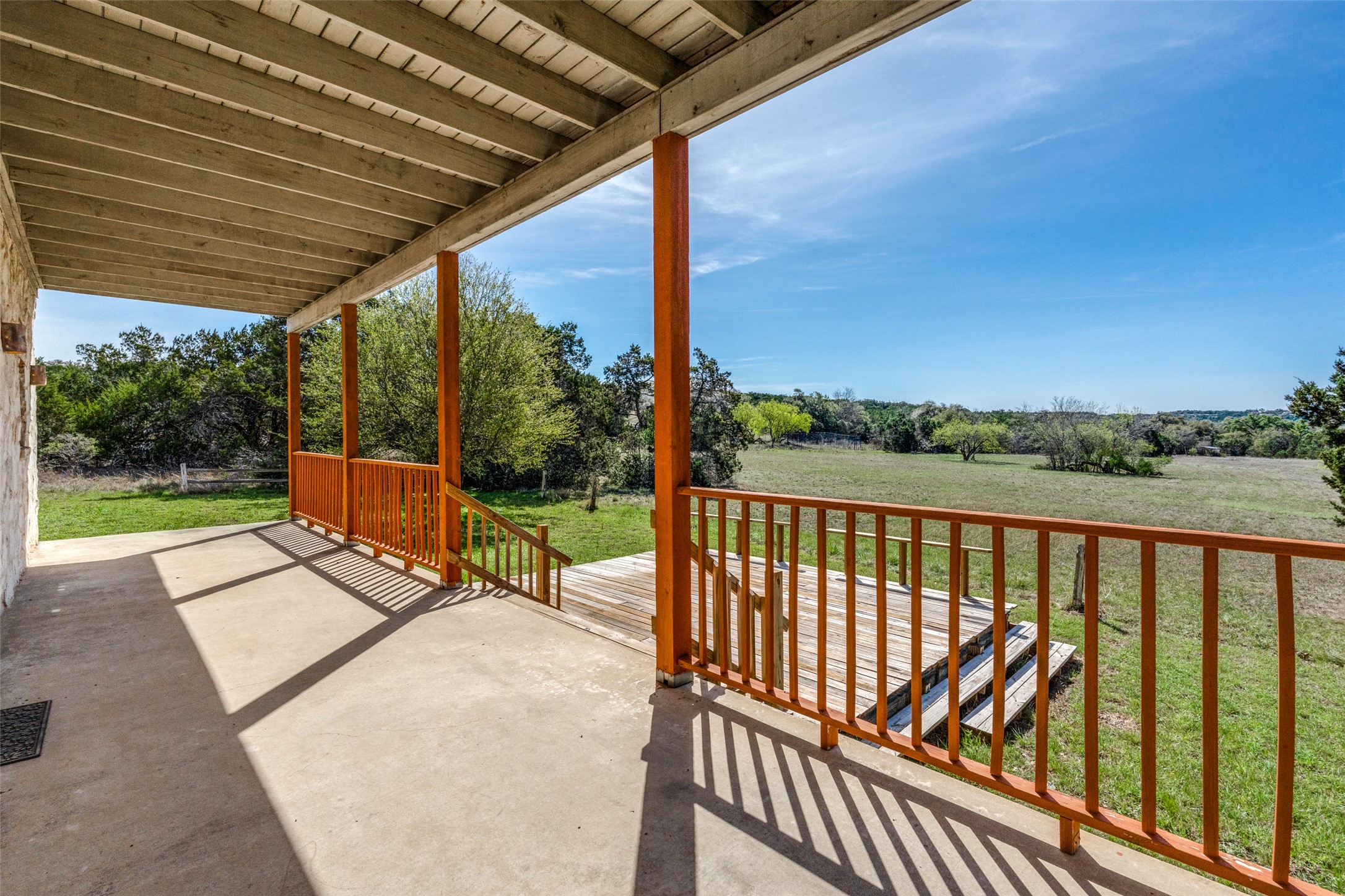 34970 Smithson Valley Road Bulverde, TX 78163 - Photo 23 of 36 a view of a patio with a table chairs and a backyard