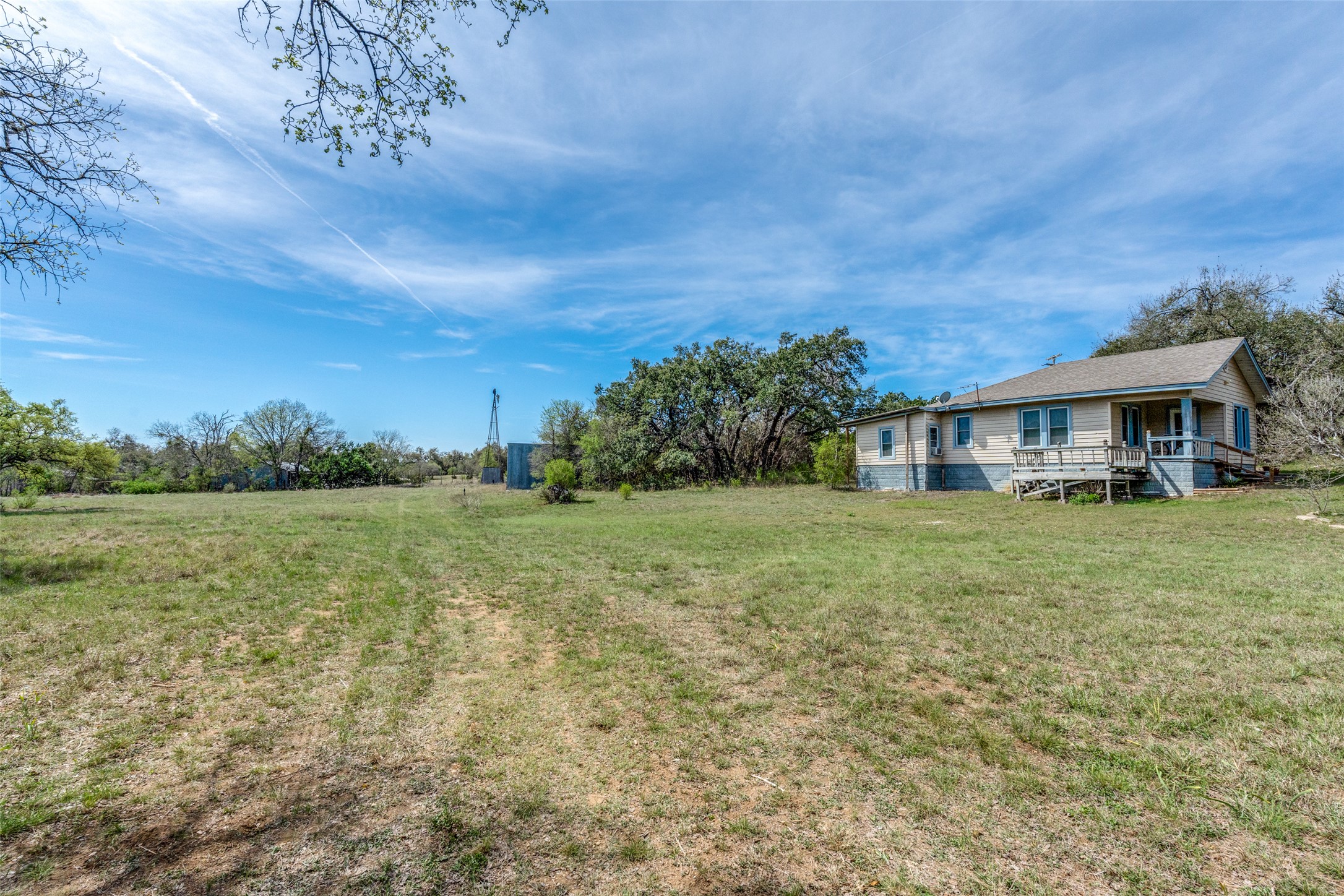 34970 Smithson Valley Road Bulverde, TX 78163 - Photo 28 of 36 a view of a house with a yard