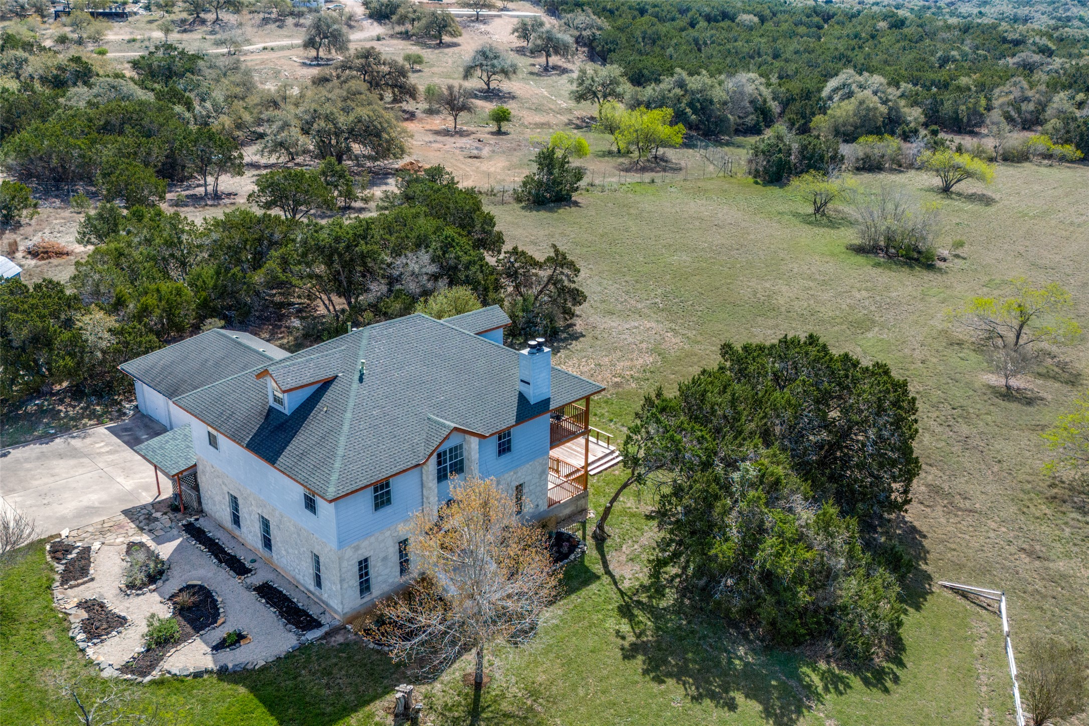 34970 Smithson Valley Road Bulverde, TX 78163 - Photo 32 of 36 an aerial view of multiple houses with yard