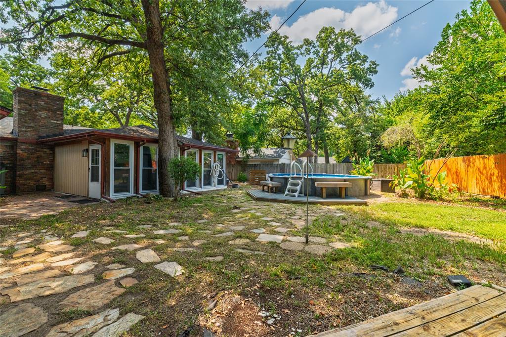 637 Post Oak Drive Hurst, TX 76053 - Photo 30 of 35 Backyard with above ground pool