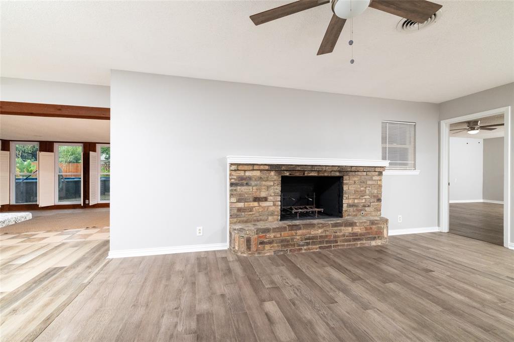 637 Post Oak Drive Hurst, TX 76053 - Photo 7 of 35 Living with wood burning fire place