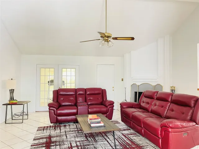 a couch sitting in a living room with furniture