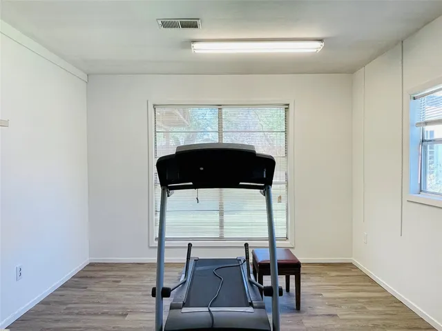 a room with furniture and wooden floor