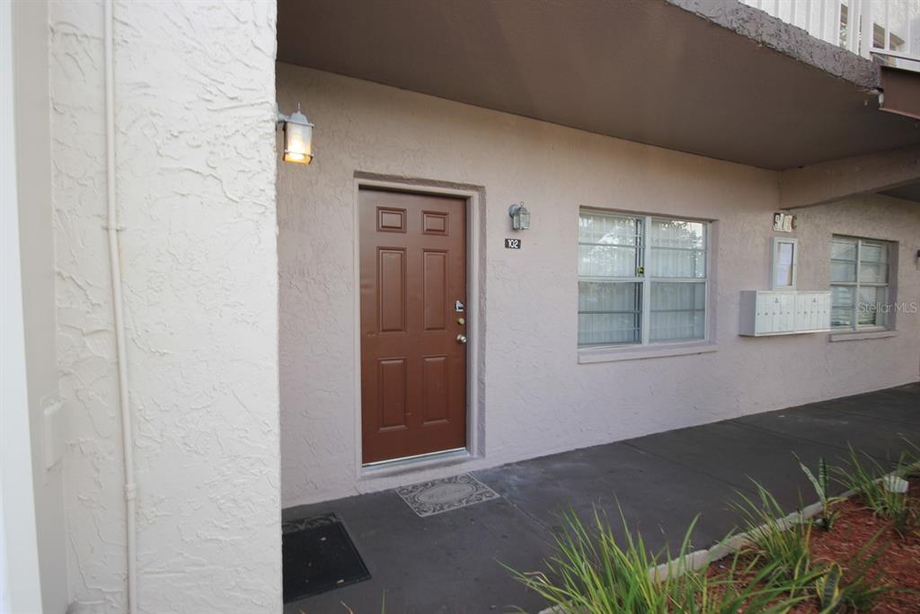 9209 Tudor Drive, Unit C102 Tampa, FL 33615 - Photo 1 of 8 an empty room with windows