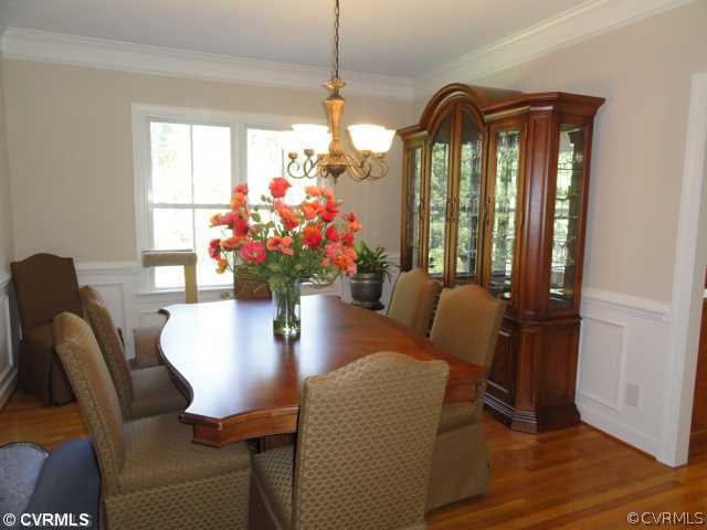 832 Club Ridge Court Chester, VA 23836 - Photo 6 of 12 a dining room with furniture and wooden floor