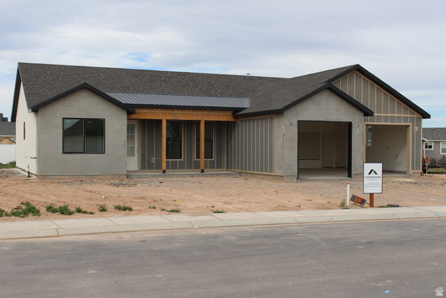 4933 East Remington Road Cedar City, UT 84721 - Photo 3 of 33 New construction residence featuring a dark shingle roof and stucco exterior