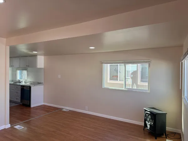 a view of a kitchen with large window